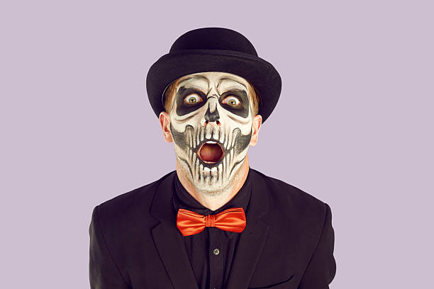 istock Horror halloween face close up view isolated on purple background. 2212532294