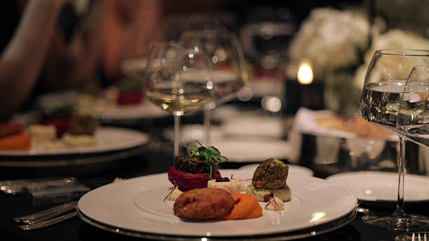 istock Elegant Fine Dining Experience at a Luxury Event. A beautifully plated dinner set on a luxurious table. 2212532764
