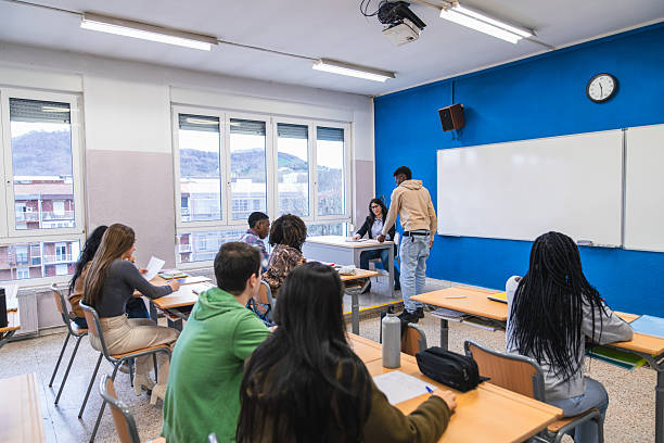 istock High school students working together in modern classroom 2212533670