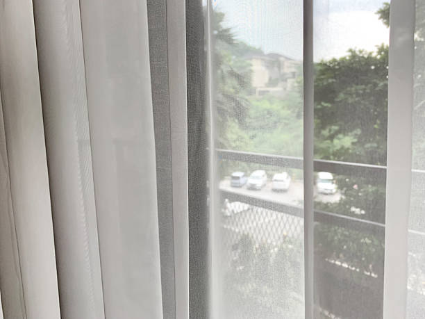 istock Sheer white curtain revealing outdoora 2212533823