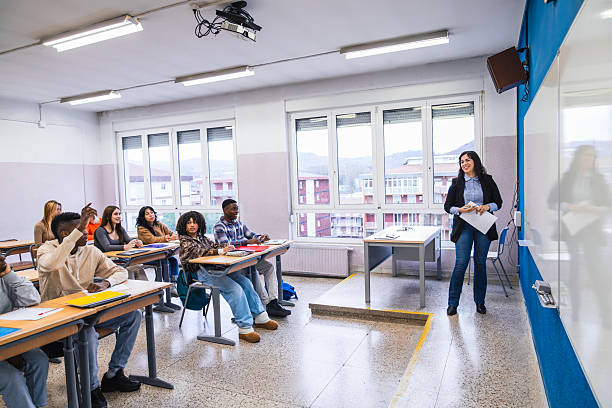 istock High school teacher giving lesson to her students 2212534979