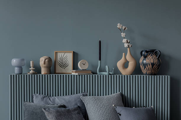 istock A modern bedroom with a sculptural bedside table, organic decor, and soft textiles. The neutral and blue color scheme enhances the peaceful, stylish ambiance. 2212537011