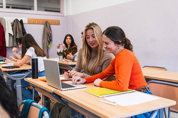 istock High school students collaborating on laptop in classroom 2212537573