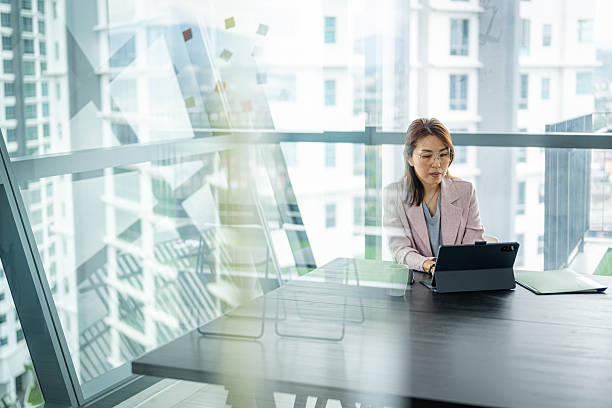 istock Focused and Driven: A Businesswoman at Work 2212539586