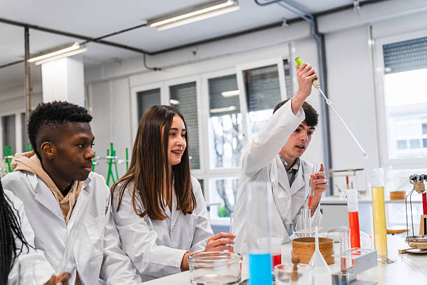 istock High school students conducting chemistry experiment in laboratory 2212540891