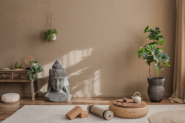 istock Meditative space with a Buddha statue, hanging plants, and soft shadows, ideal for moments of tranquility. 2212540967