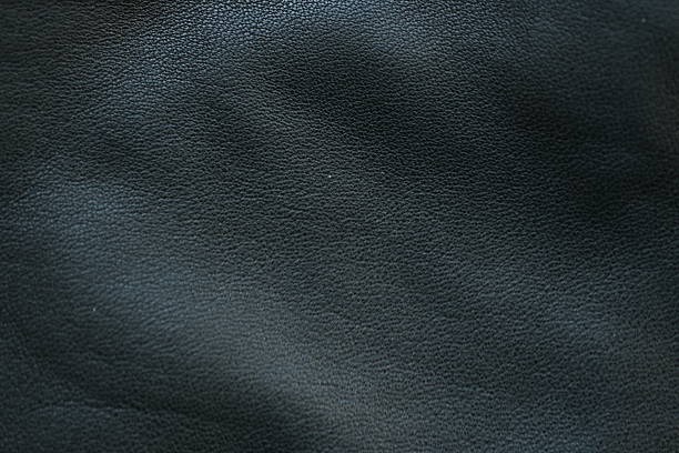 istock black leather texture close-up, seams on leather jacket as background, black natural leather as background, black leather stitching 2212542449