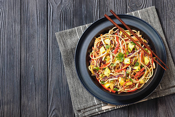 istock Thai Mango Noodle Veggie Salad in a bowl 2212542463