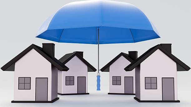 istock A small house under a large umbrella. 2212546837