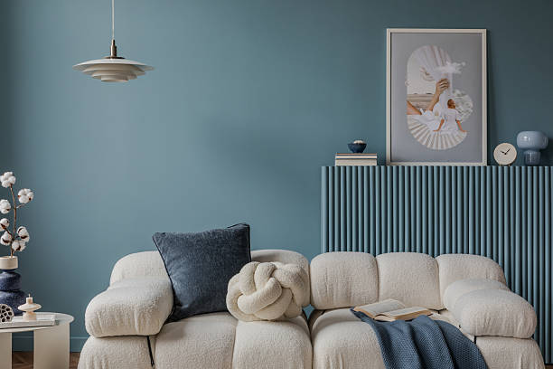 istock A vibrant blue-themed living space featuring geometric patterns and textures on pillows. Modern home decor. 2212546951