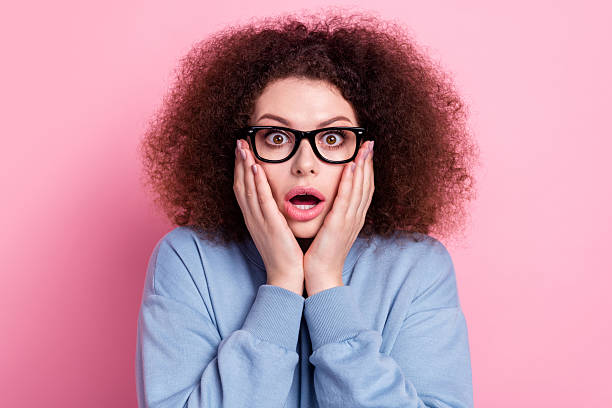 istock Photo of excited funky lady dressed blue pullover eyewear open mouth arms cheeks isolated pink color background 2212549470