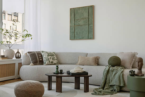 istock Elegant sofa space with green accents and soft textures, creating a warm, tranquil environment. 2212549501