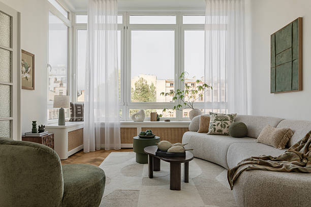 istock Bright, cozy living room with natural light, lush plants, and soft textures, creating an inviting modern sanctuary. Home decor. 2212549514