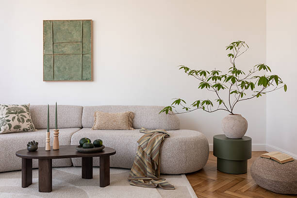 istock Cozy living room with a soft sectional, rustic coffee table, and lush plants, perfect for relaxing in style. Home decor. 2212549596