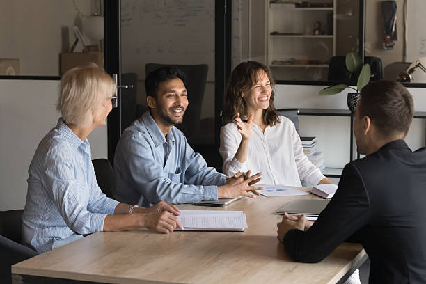 istock Happy diverse business people communicating 2212549935