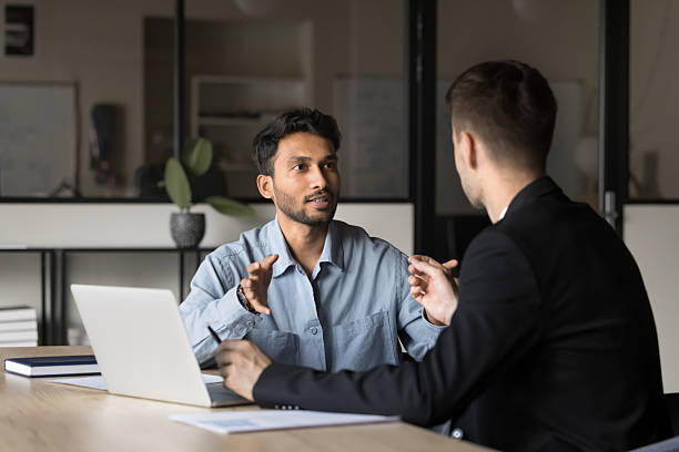 istock Two diverse businesspeople lead collaborative discussion 2212550093