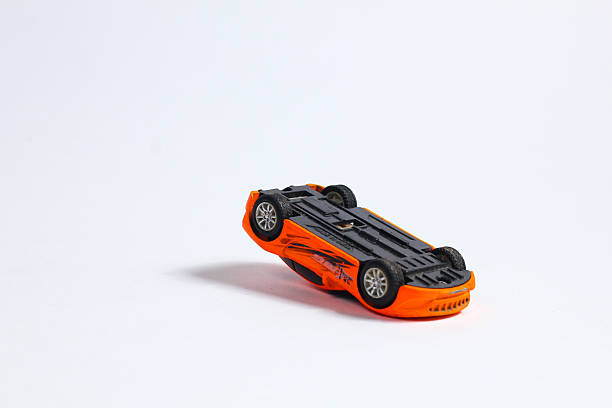 istock toy car upside down isolated on white background 2212551123