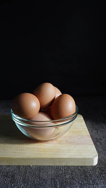 istock Some eggs on a wooden cutting board 2212551884