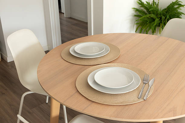 istock Minimal table setting on wood table in modern domestic room 2212552553