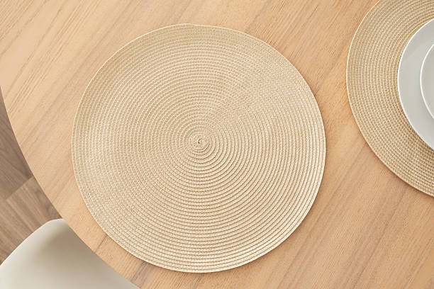 istock Minimalist aesthetic woven placemat on wooden table 2212552562