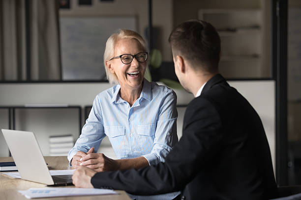 istock Two happy businesspeople engaged in candid discussion 2212555155