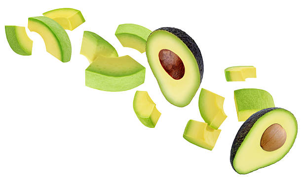 istock Levitating Avocado pieces isolated on white. Flying Avocado fruit chunks. Avocado Explosion. Top view. Flat lay. Package design element 2212555548