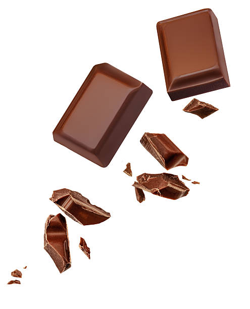 istock Chocolate bar  pieces  Explosion. Levitating dark chocolate pieces shattering isolated on white background. Falling  Chocolate chunks with choco crumbs. Package design element 2212556161