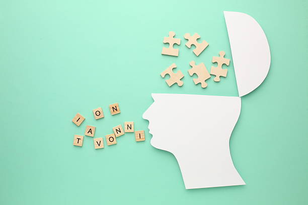 istock Creative thinking ideas and innovation concepts. A light bulb in yellow colour on the background. Human head with puzzle, jigsaw puzzle 2212556298