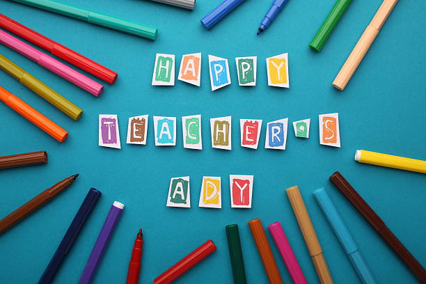 istock Teacher's Day celebration with students, gifts, and gratitude. 2212556365