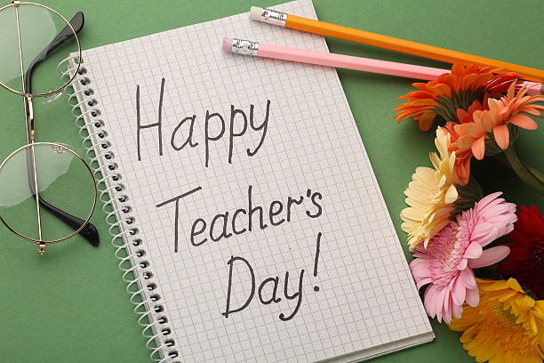 istock Teacher's Day celebration with students, gifts, and gratitude 2212556402