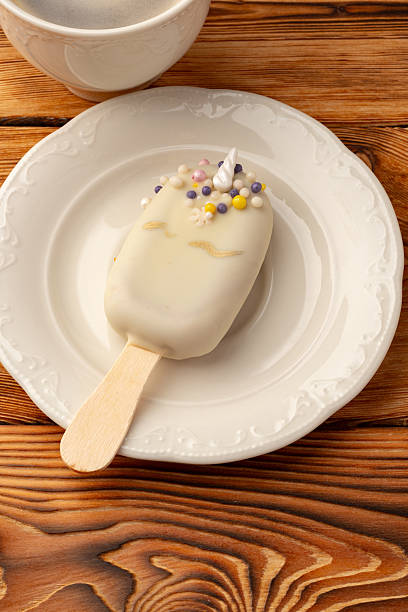 Delightful white dessert on a plate with colorful decorations enjoyed during afternoon tea