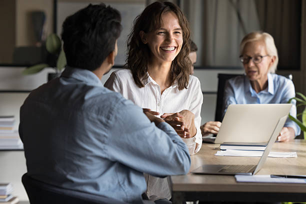 istock Executive business lady laughs enjoying project discussion 2212557369