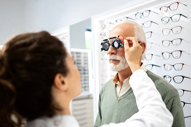 istock Senior man checking diopter and eyesight. 2212557513