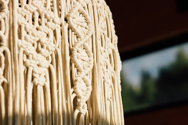 Intricate macrame wall hanging showcasing craftsmanship and design in a cozy indoor setting