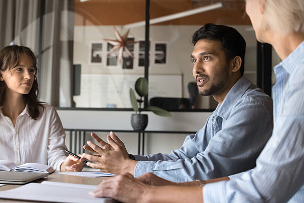 istock Company executive analyst making report at meeting 2212559169