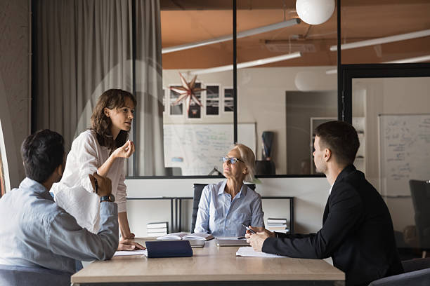 istock Professional executives working on corporate together at conference 2212559330