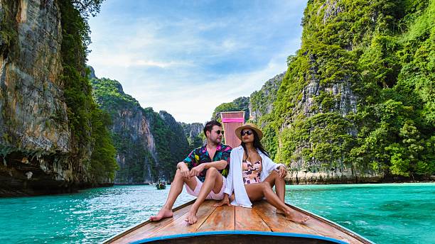 istock Couple enjoying a romantic moment on a longtail boat in Koh Phi Phis stunning lagoon 2212560108