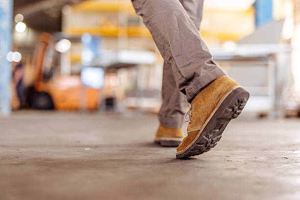 Close-Up of Walking Boots in a Warehouse Environment stock photo