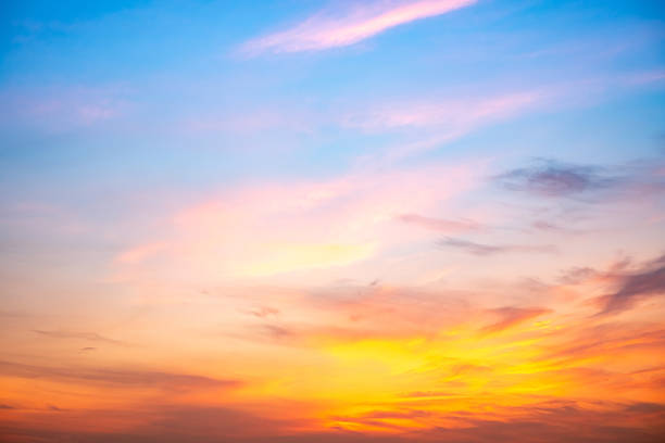 istock Beautiful , luxury soft gradient orange gold clouds and sunlight on the blue sky perfect for the background, take in evening,Twilight, Large size, high definition landscape photo 2212565348