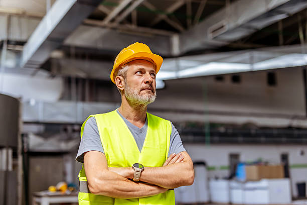 istock Factory Worker in Safety Gear Standing Confidently in Industrial Setting 2212566871