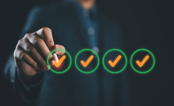 istock Quality check, Businessman makes a checklist Assessment and questionnaire, businessman using smartphone to do online survey, online digital form check mark Choose the correct answer on the exam. 2212567345