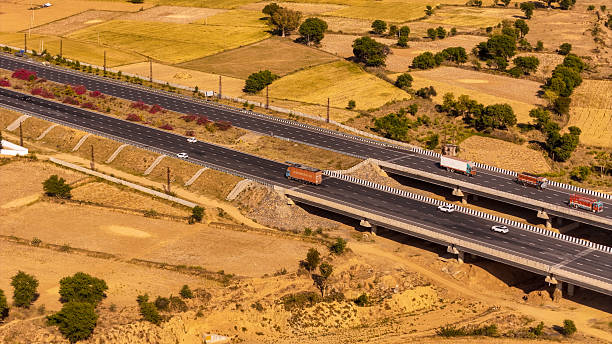 istock highway road in rajasthan with vehicles 2212571536