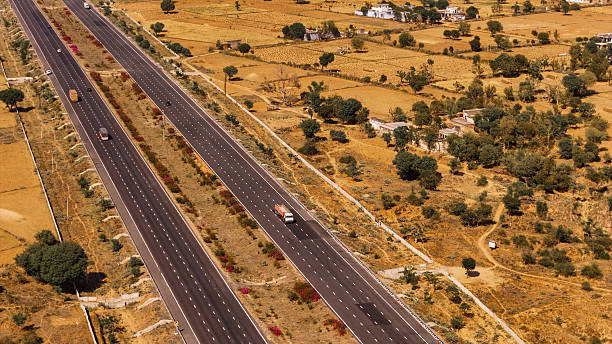 istock vehicles on Jaipur delhi highway road drone view 2212571726