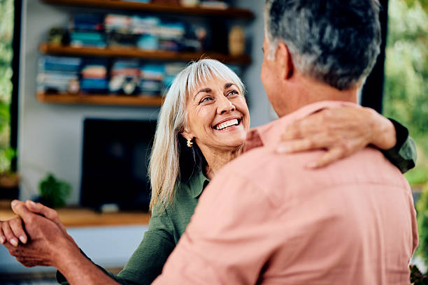 istock Affectionate senior couple dancing, woman looking towards man, smiling 2212571903