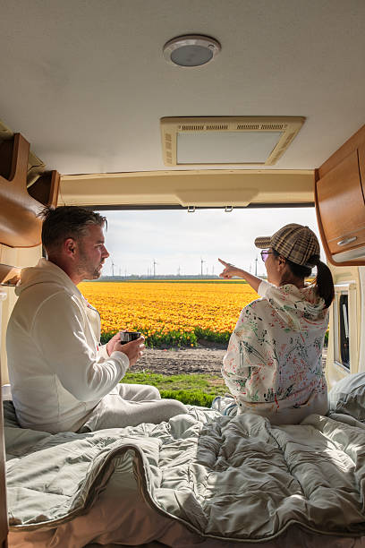 istock Enjoying tulip fields in a cozy camper van during springtime in Flevoland, Netherlands 2212572991