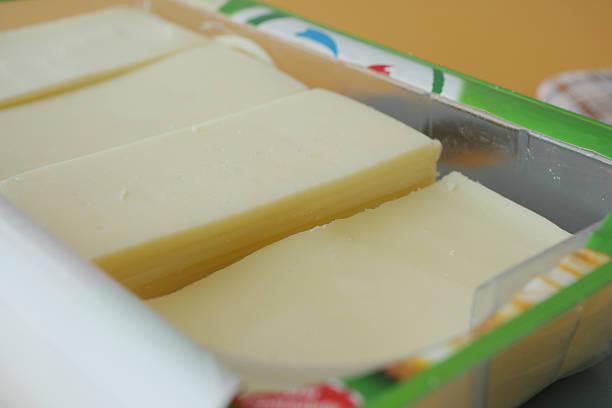 istock Sliced Cheese in Special Packaging for Various Culinary Uses and Dishes 2212574931