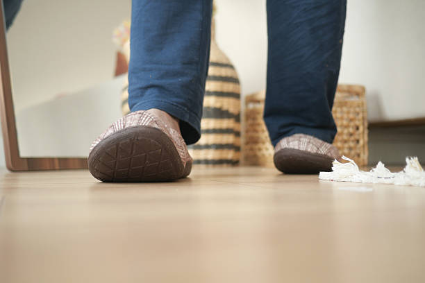 istock man in soft slippers at home 2212575276