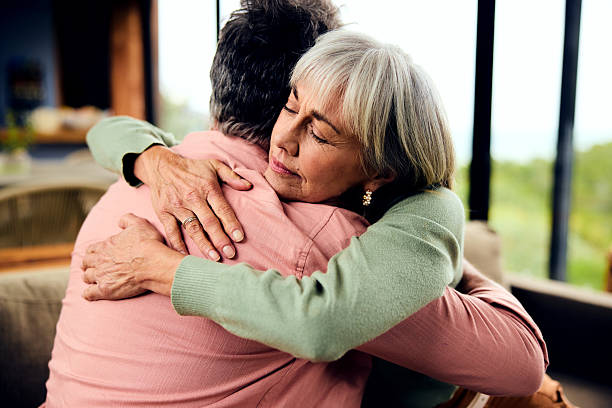 istock Senior couple embracing and supporting each other 2212575816