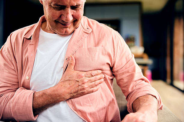 istock Concerned mature man with hand on chest 2212575835