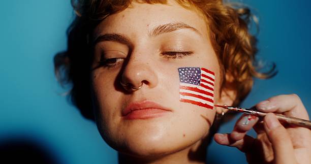 istock Celebrating identity with a vibrant flag face painting 2212580883